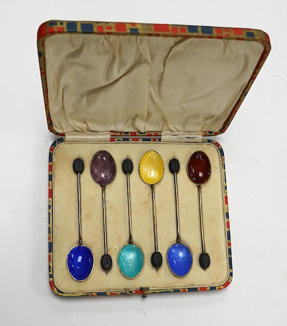 A cased set of six George V silver and polychrome enamelled coffee spoons, by Henry Clifford Davis, Birmingham, 1919. Condition - fair